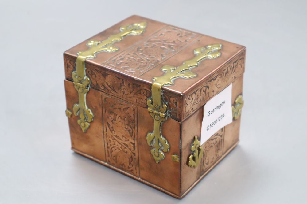 A copper brass mounted miniature casket, width 10cm height 9cm